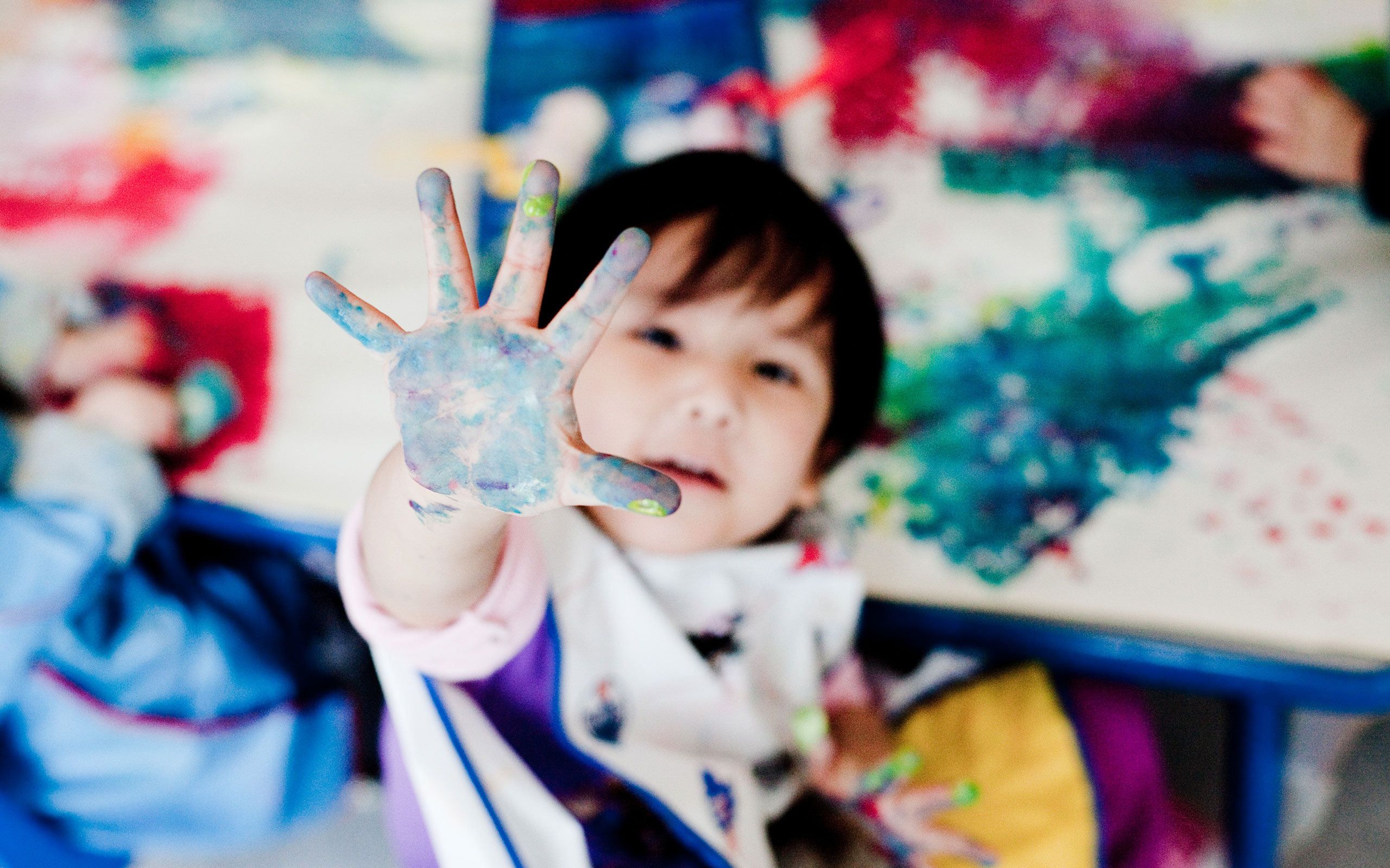 Child with painted hand